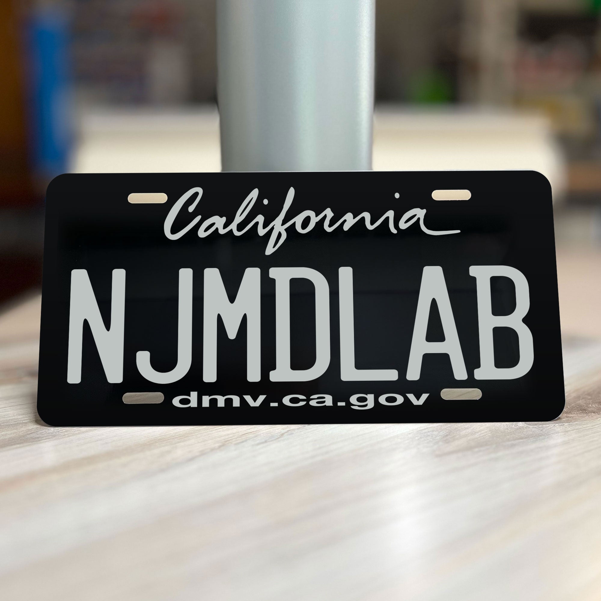 Retailer black lab license plate